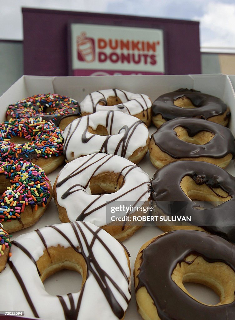 A dozen doughnuts are pictured outside a