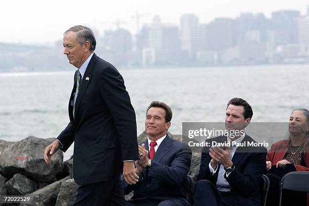 New York Mayor George Pataki walks to the podium as California Governor Arnold Schwarzenegger and San Francisco Mayor Gavin Newsom applaud September...