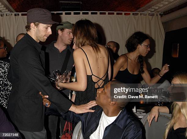 Chris Martin, Jay-Z and Gwyneth Paltrow attend the after party following the concert by Jay-Z at The Royal Albert Hall, at Movida on September 27,...