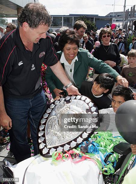 Allan Pollock, Coach of North Harbour passes the Ranfurly Shield around to fans before a float parade for the North Harbour Rugby Team makes it way...