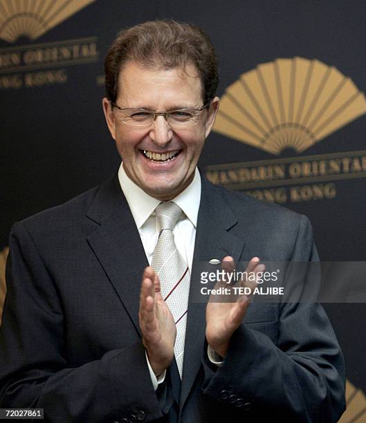 Edouard Ettedgui, chief executive Mandarin hotel group applauds during the re-opening ceremony of the Mandarin hotel in Hong Kong, 28 September 2006....