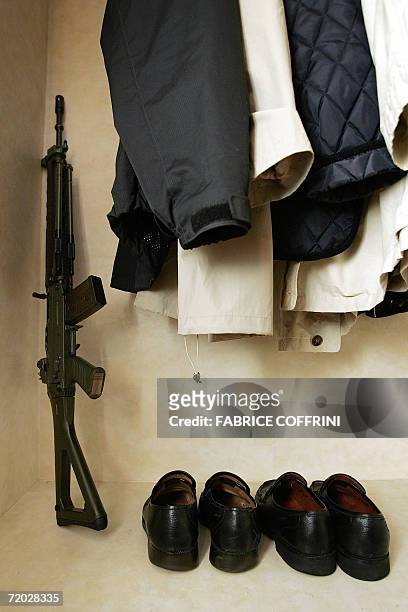 Semi-automatic army service weapon is stored 25 September 2006 in a walk-in closet in Pully. A Swiss women's magazine, Annabelle, is taking aim at an...
