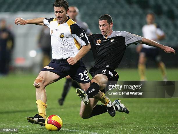 Che Bunce of the Knights cuts down Damian Mori of the Mariners and concedes a penality during the round six A-League match between the New Zealand...
