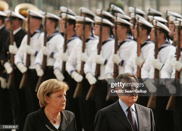 German Chancellor Angela Merkel and Lebanese Prime Minister Fuad Siniora review a guard of honour of German Navy sailors upon Siniora's arrival at...