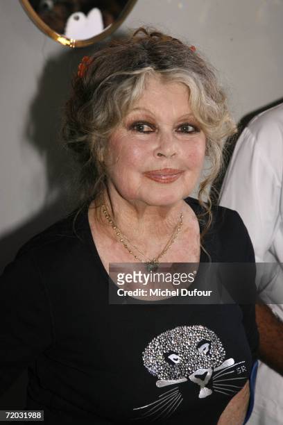 Brigitte Bardot gets ready to cut the party cake at The Brigitte Bardot Foundation's anniversary party at the Marigny Theater, near the Champs...