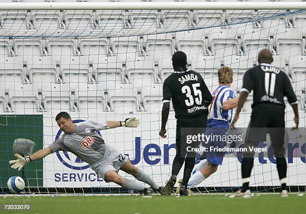 Mads Timm of Odense scores the first goal during the UEFA Cup second leg match between Odense BK and Hertha BSC Berlin at the Fionia Park on...