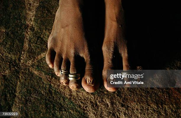 Yellama wears toe rings which signify that she is married to the goddess she has been named after in her home in this photo taken on August 23, 2005...