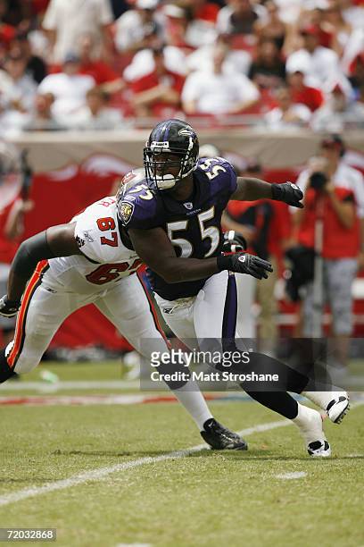 Linebacker Terrell Suggs of the Baltimore Ravens makes a move around tackle Kenyatta Walker of the Tampa Bay Buccaneers during the NFL game on...