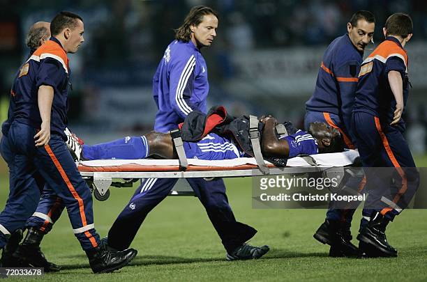 Injured Gerald Asamoah of Schalke is carried from the pitch during the UEFA Cup second leg match between AS Nancy and Schalke 04 at the Marcel Picot...
