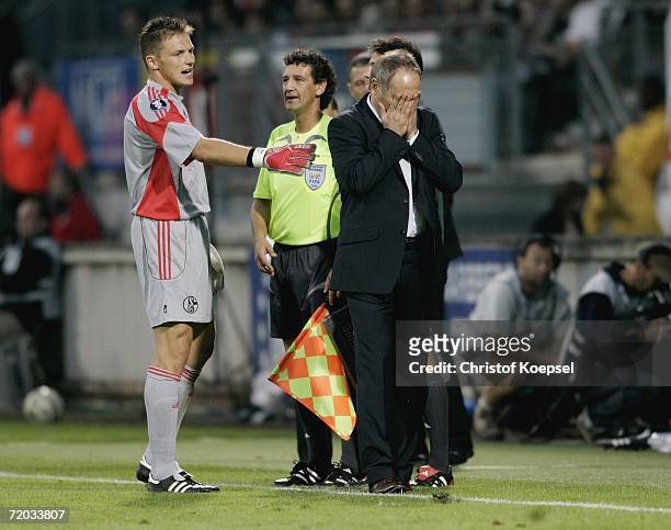 Goalkeeper Frank Rost of Schalke comforts manager Andreas Mueller during the UEFA Cup second leg match between AS Nancy and Schalke 04 at the Marcel...