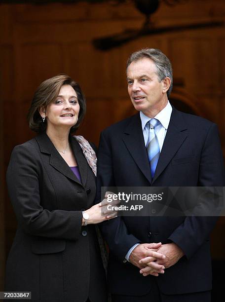 Princes Risborough, UNITED KINGDOM: British Prime Minister Tony Blair and his wife Cherie Blair wait for the arrival of Pakistan President Pervez...