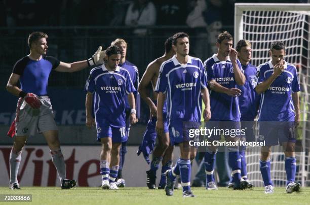 Frank Rost, Lincoln, Zlatan Bajramovic, Marcelo Bordon and Peter Loevenkrands of Schalke walk off the pitch after losing 3-1 during the UEFA Cup...