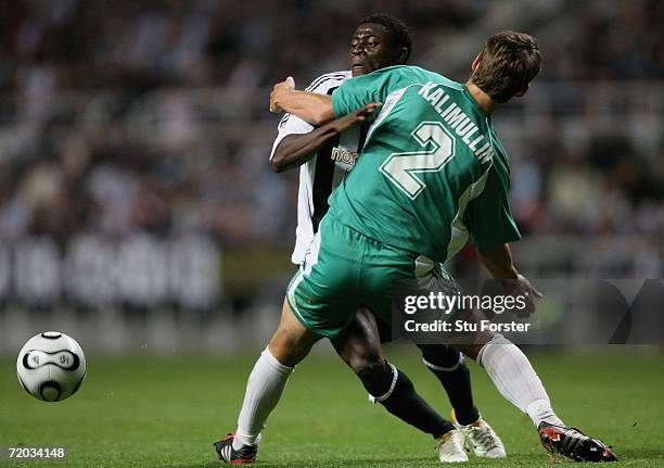 Tallin defender Andrei Kalimullen holds back Newcastle striker Obafemi Martins during the second leg of the UEFA Cup first round between Newcastle...