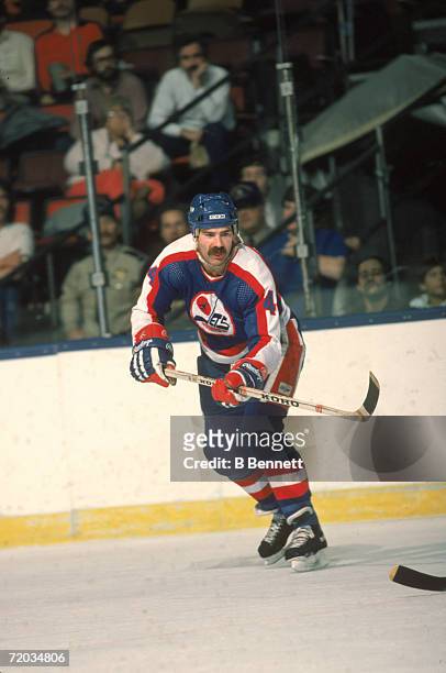 Canadian professional hockey player Dave Babych, defenseman for the Winnipeg Jets, skates on the ice during a game with the New York Islanders at...