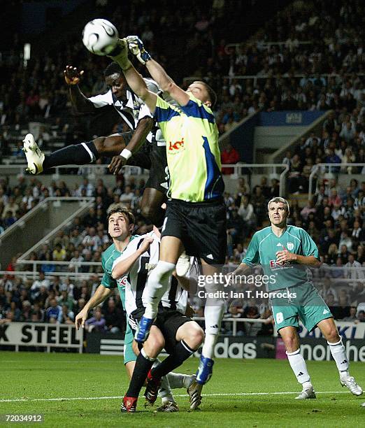 Obafemi Martins of Newcastle challenges goal keeper Artur Kotenko of Tallinn during the UEFA Cup First round, Second leg match between Newcastle...