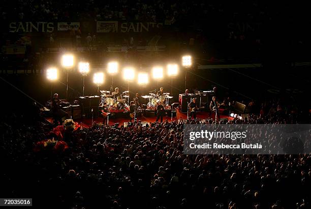 The Edge of U2, Billie Joe Armstrong, the lead singer for the rock group Green Day and Bono of U2 perform prior to the Monday Night Football game...