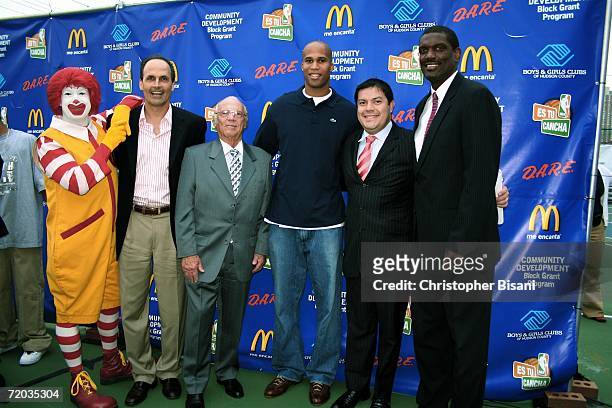 Player Richard Jefferson of the New Jersey Nets and NBA legend Albert King attend a new basketball court ribbon cutting ceremony at Jersey City Boys...