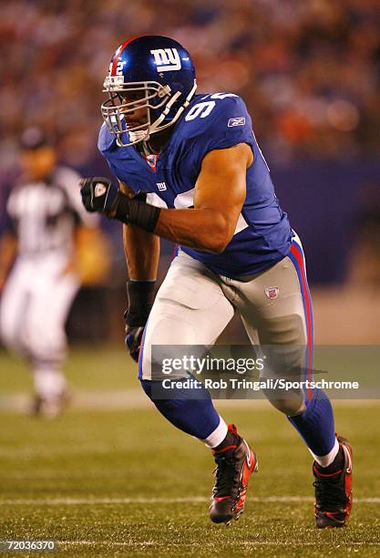 Michael Strahan of the New York Giants rushes the quarterback against the Indianapolis Colts on September 10, 2006 at Giants Stadium in East...
