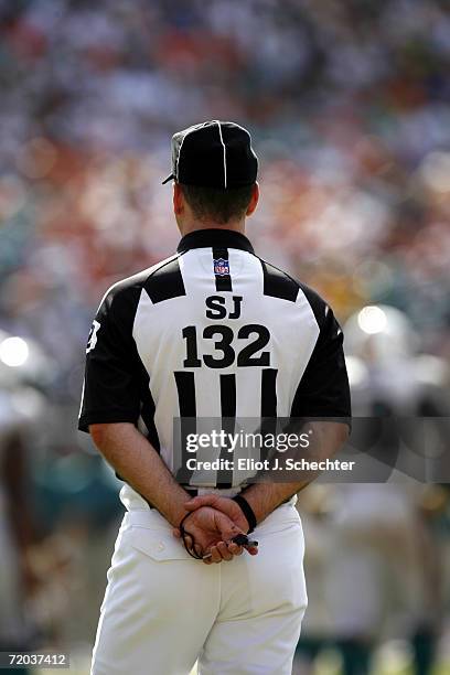 Side judge John Parry watches the game between the Miami Dolphins and the Tennessee Titans at Miami Dolphin Stadium on September 24, 2006 in Miami,...