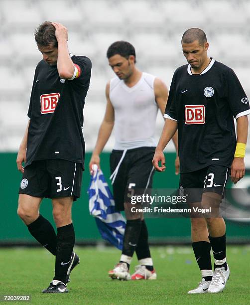 Arne Friedrich, Sofian Chahed and Christian Gimenez of Hertha looks dejected after the UEFA Cup second leg match between Odense BK and Hertha BSC...