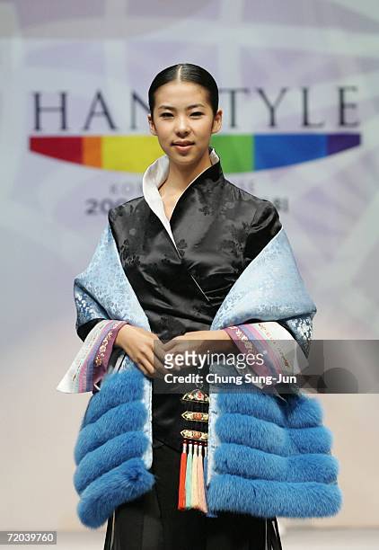 Model walks down the catwalk during the Paik Seol-Heon fashion show as part of the South Korean Traditional Costume "HanBok" fashion show on...