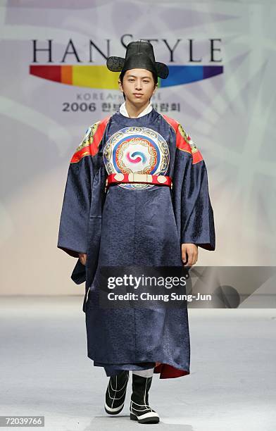 Model walks down the catwalk during the Paik Seol-Heon fashion show as part of the South Korean Traditional Costume "HanBok" fashion show on...