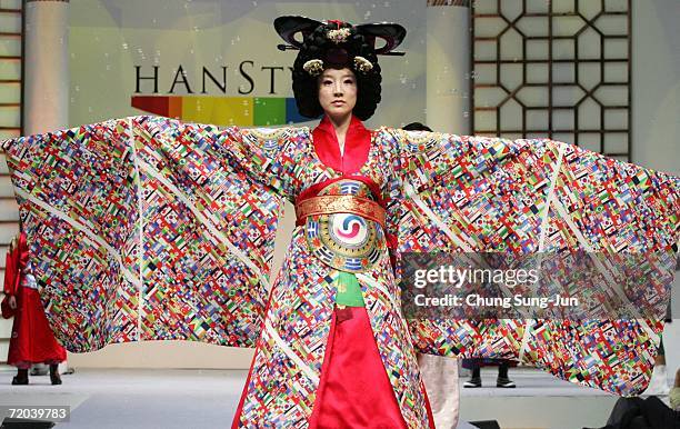 Model walks down the catwalk during the Paik Seol-Heon fashion show as part of the South Korean Traditional Costume "HanBok" fashion show on...