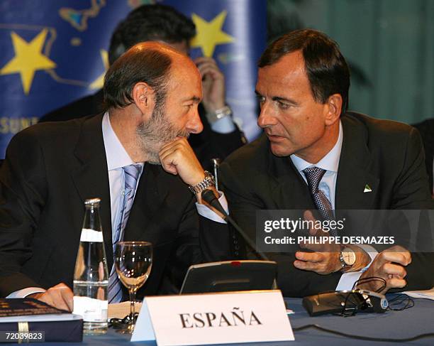 Spanish Interior minister Alredo Perez Rubalcaba speaks with EU commissioner for Interior affairs Franco Frattini prior to the start of an...