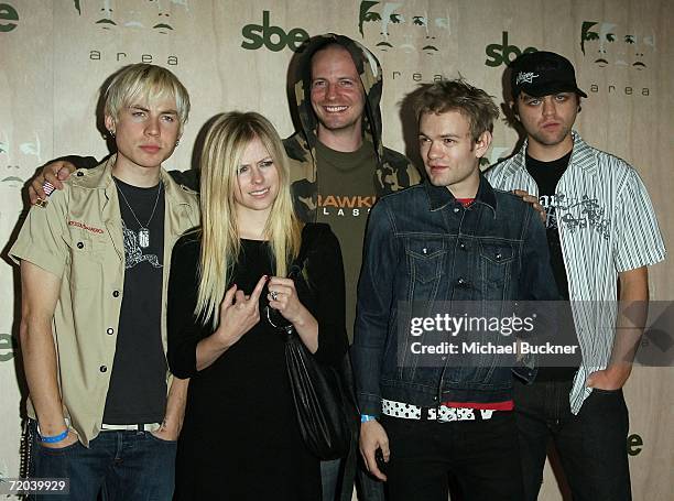 Singers Avril Lavigne and Deryck Whibley arrive at the AREA Nightclub Grand Opening on September 28, 2006 in Los Angeles, California.