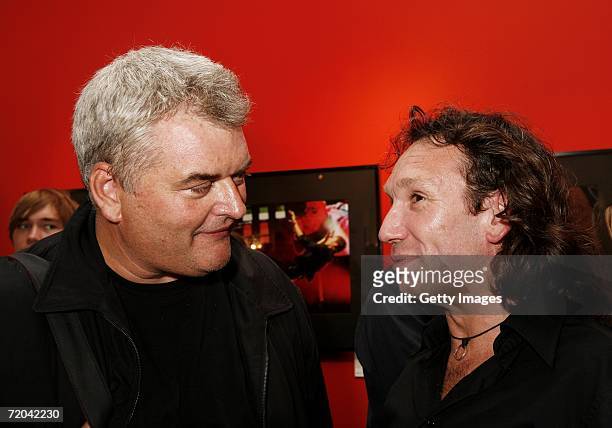 Photographers Dave Hogan and Mick Hutson talk at the Q Idols Exhibition at the Getty Gallery on September 28, 2006 in London, England. The...