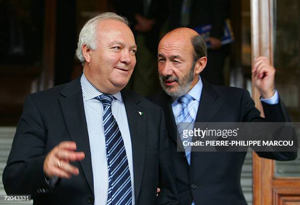 Spanish Foreign Minister Miguel Angel Moratinos chats with Interior Minister Alfredo Perez Rubalcaba during the eight-country round table on...