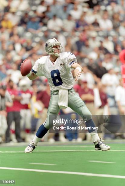 Troy Aikman of the Dallas Cowboys drops back to pass the ball during the game against the Arizona Cardinals at the Texas Stadium in Irving, Texas....