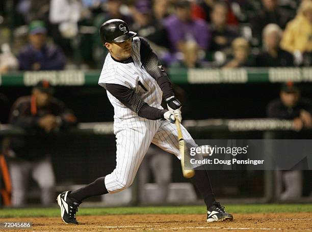 Jamey Carroll of the Colorado Rockies swings at the pitch during the game against the San Francisco Giants at Coors Field on September 18, 2006 in...