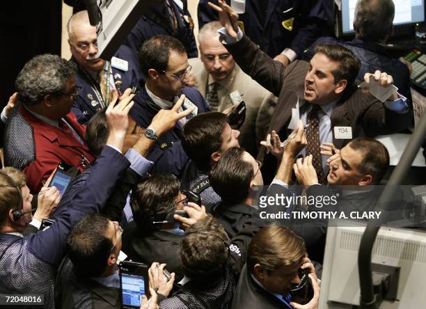 New York, UNITED STATES: A trader yells out orders on Tim Hortons stock on the floor of the New York Stock Exchange 29 September 2006 in New York...