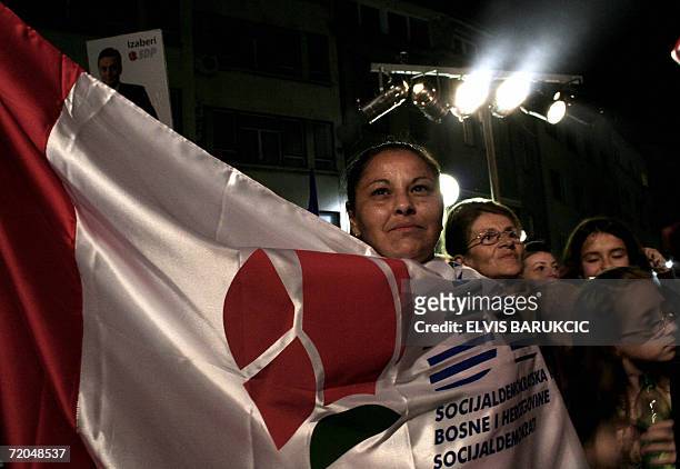 Sarajevo, BOSNIA AND HERCEGOVINA: A Bosnian woman, supporter of Social Democratic Party , wraps herself in a SDP flag during a final pre-election...