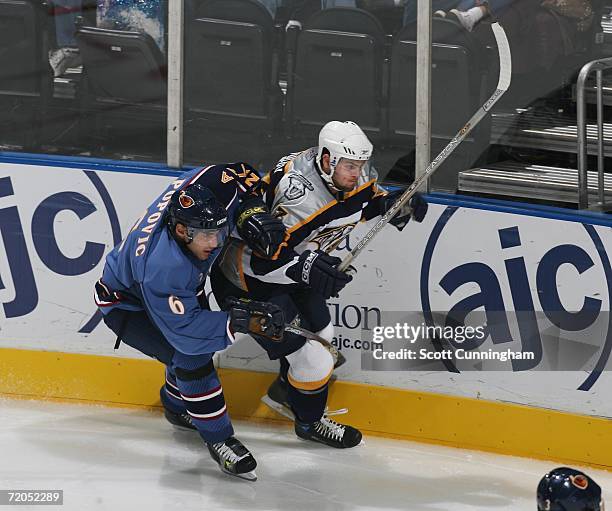 Mark Popovic of the Atlanta Thrashers defends Alexander Radulov of the Nashville Predators on September 29, 2006 at Philips Arena in Atlanta, Georgia.