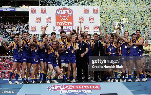 The Eagles celebrate with the trophy after the AFL Grand Final match between the Sydney Swans and the West Coast Eagles at the Melbourne Cricket...