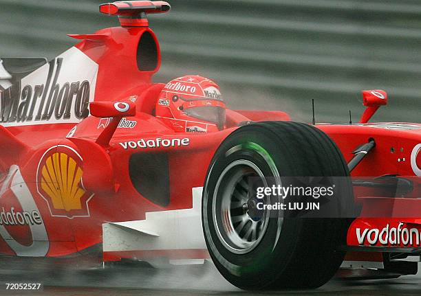 German Ferrari driver Michael Schumacher steers his race car during the qualifying session in Chinese Grand Prix at the Shanghai International...