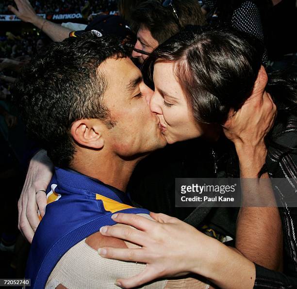 Daniel Kerr of the Eagles kisses his partner Melanie Cousins after the AFL Grand Final match between the Sydney Swans and the West Coast Eagles at...