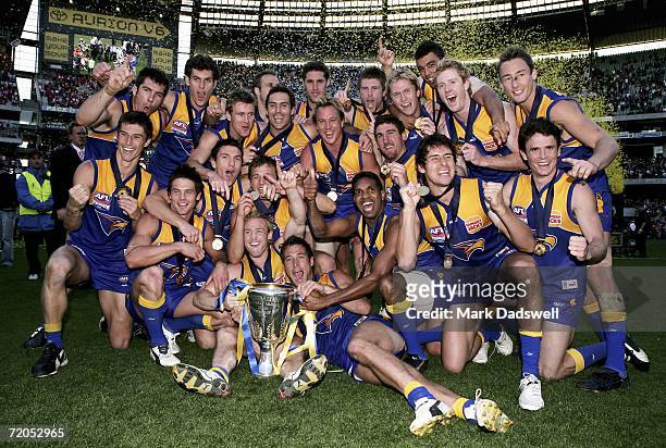 West Coast Eagles players celebrate after winning the AFL Grand Final match between the Sydney Swans and the West Coast Eagles at the Melbourne...