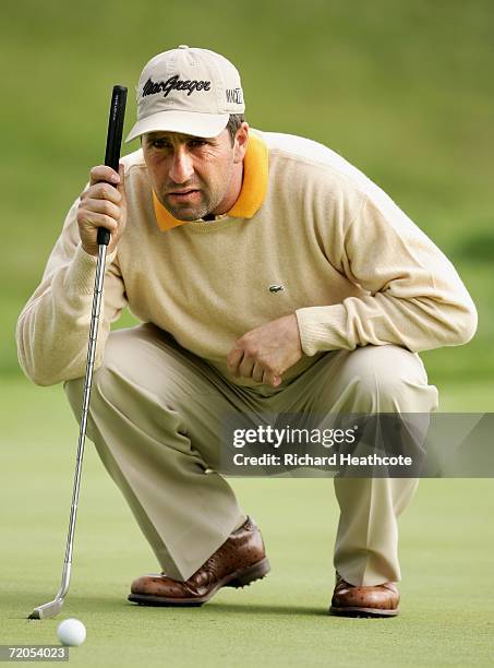 Jose-Maria Olazabal of Spain lines up a putt during the third round of the WGC American Express Championship at The Grove on September 30, 2006 in...