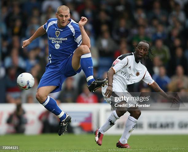 Cardiff defender Darren Purse beats Jemal Johnson to the ball during the Coca Cola Championship match between Cardiff City and Wolverhampton...