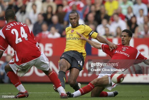 Thierry Henry of Arsenal attempts to shoot past Talal El Karkouri and Jonathan Fortune of Charlton during the Barclays Premiership match between...