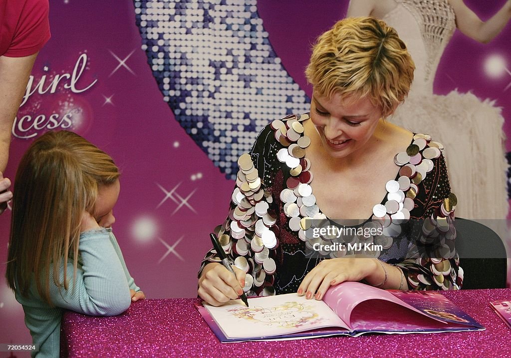 Kylie Minogue Signs Copies Of Her Book 'The Showgirl Princess'