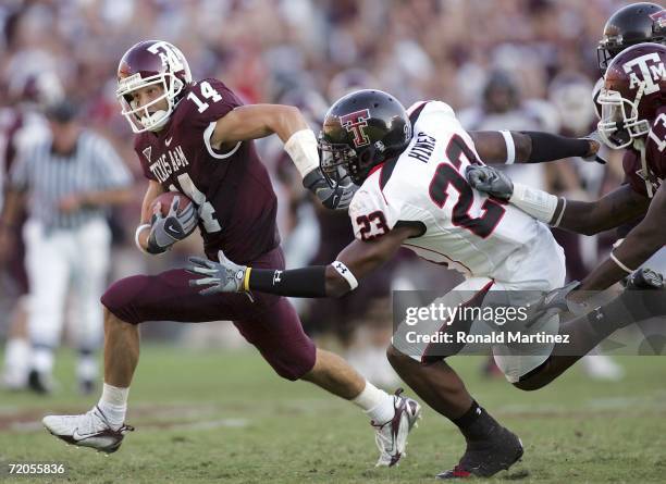 Wide receiver Chad Schroeder of the Texas A&M Aggies runs past Anthony Hines of the Texas Tech Red Raiders at Kyle Field on September 30, 2006 in...