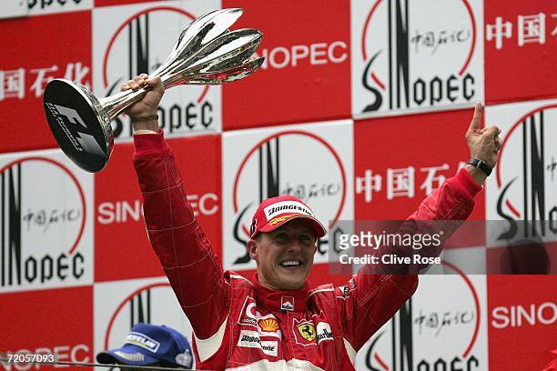 Michael Schumacher of Germany and Ferrari celebrates on the podium after winning the Formula One Chinese Grand Prix at Shanghai International Circuit...