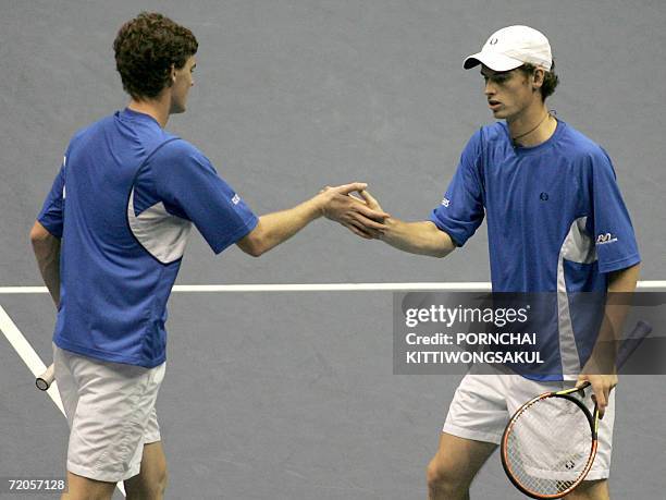 Andy Murray and Jamie Murray of England celebrate a point against Jonathan Erlich and Andy Ram of Israel during the doubles final match of the tennis...