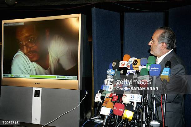 Iraqi National Security Advisor Muwaffaq al-Rubaie plays video images of al-Qaeda's leader in Iraq, Abu Ayyub al-Masri during a press conference in...