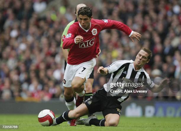 Scott Parker of Newcastle United tackles Cristiano Ronaldo of Manchester United during the Barclays Premiership match between Manchester United and...