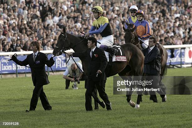 Japanese wonder horse Deep Impact and jockey Yutaka Take take part in the parade beforeThe Prix De L'Arc De Triomphe run at Longchamp Racecourse on...